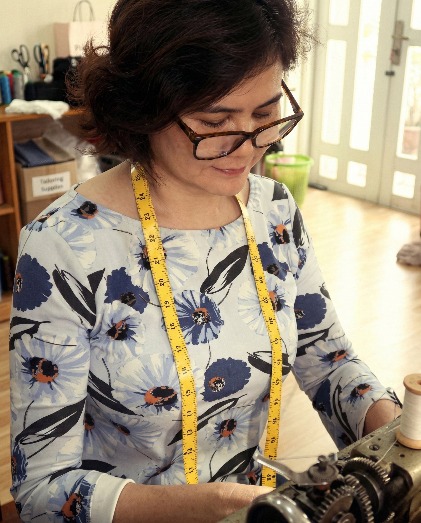 A DINS artisan working with precision at a sewing machine
