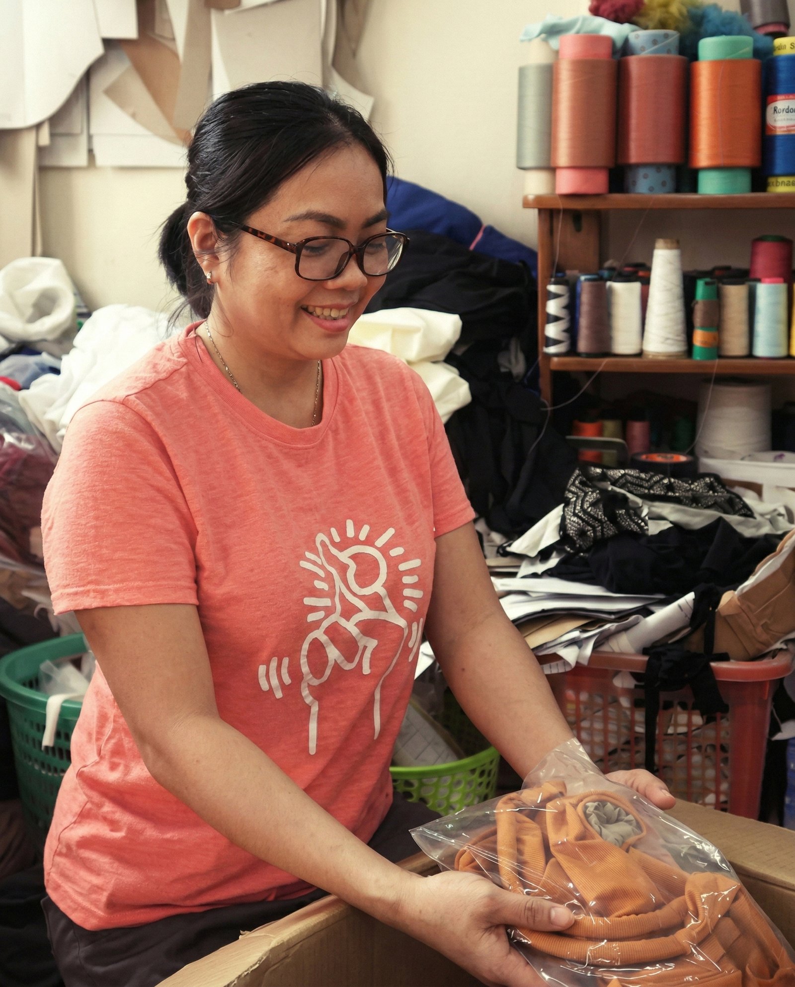 A woman preparing a DINS piece in the atelier